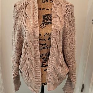 Draped tan long sleeved open front sweater.